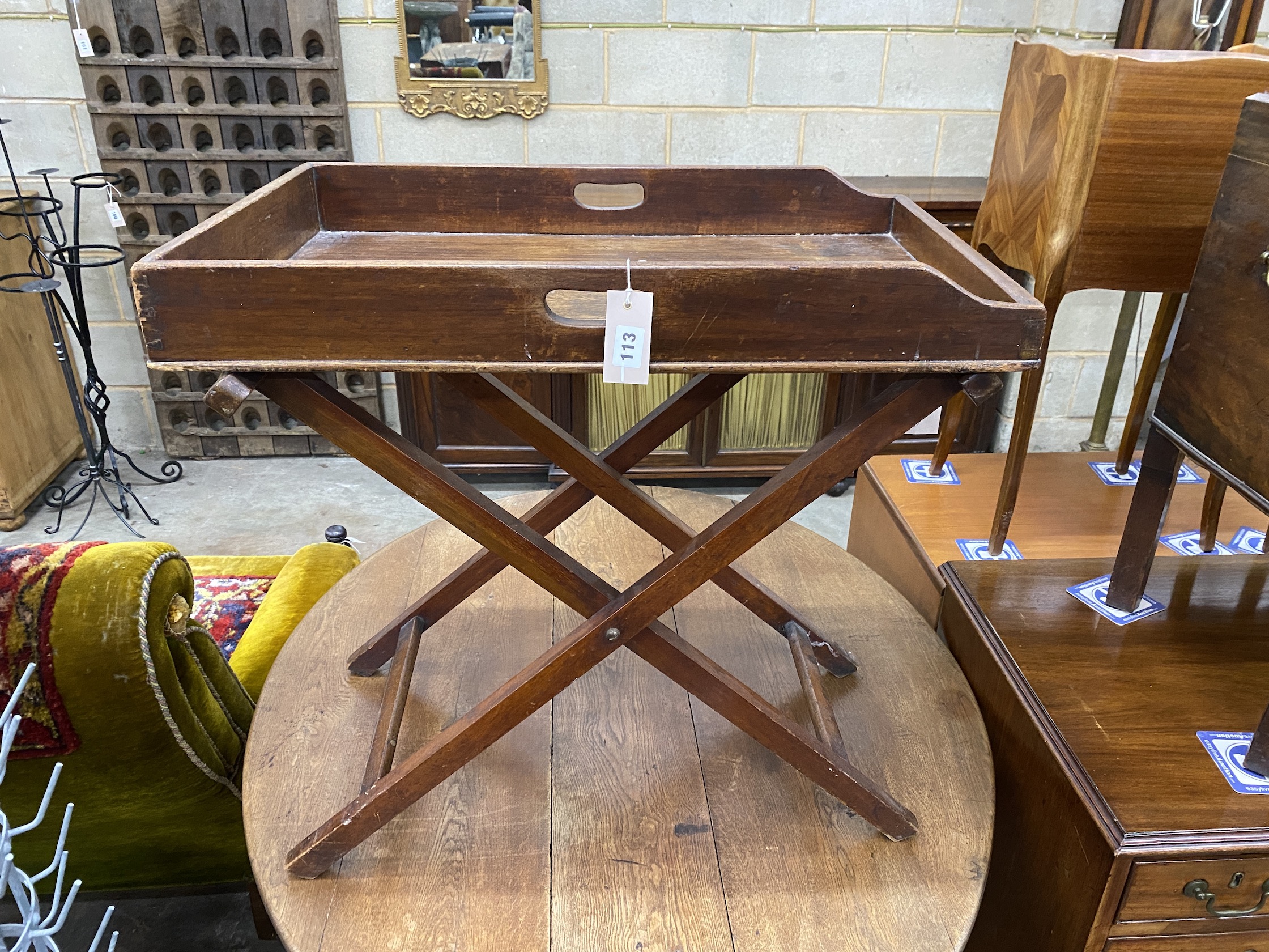 A Victorian mahogany butler's tray on folding stand, width 70cm, depth 44cm, height 70cm, NB: From the Estate of Rt Hon Lord Lawson of Blaby